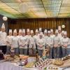 Students in the Pastry Food Show and Buffet Presentation Concepts course, which presents the Grand Pastry Buffet, take a pre-event photo with two of their faculty members: Chef Charles R. Niedermyer, (left) and Chef Todd M. Keeley, instructors of baking and pastry arts/culinary arts.