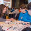 Alicia McNett, instructor of computer information technology at Penn College, guides a high school student in programming an Ozobot. The workshop was part of an “Hour of Code” event hosted by Penn College and attended by several high schools. It is part of an international initiative to encourage interest and confidence in the skills needed to join the computer science workforce.