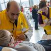 Samer R. Doss, a PA student from Montoursville, listens to the heartbeat of dental hygiene student Megan P. Fitzsimmons, of Portville, N.Y.