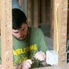 Jon A. Good, of Emporium, wires an outlet at a house owned by Sojourner Truth Ministries in Williamsport. Good was one of 14 electrical construction students at Pennsylvania College of Technology who served area nonprofit organizations for the Construction Lab IV: Practical Experience course.