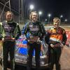 December Pennsylvania College of Technology graduate Joseph C. Lusk (right) celebrates a second-place finish at Heartland Raceway in Moama, Australia, as part of the Late Model Racing Victoria Series. Lusk spent a month in Australia (early in 2020, before COVID- 19 travel restrictions), racing with the team of Danny Amato and completing an anthropological study. (The Amato car is in the background, at right.)