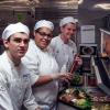 Penn College culinary arts and systems students R. Colby Janowitz, of Westminster, Md.; Amaris T. Smith, of Williamsport; and Cy C. Heller, of Milton, work an à la carte lunch in the Turf Room on Oaks Day at Churchill Downs.