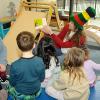 Savage engages her audience with some purposeful monkey business, reading from "Hand, Hand, Fingers, Thumb."