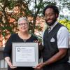 LaQuinn N. Thompson, of York, recipient of Pennsylvania College of Technology’s Alumni Achievement Award, displays the honor with President Davie Jane Gilmour.