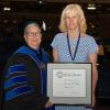 Joanna K. Flynn, associate professor of mathematics, was presented with the highest honor accorded to Penn College faculty – the Veronica M. Muzic Master Teacher Award – at Spring 2018 Commencement. She is shown here with Penn College President Davie Jane Gilmour.