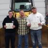 Penn College students Benjamin P. Coppola (left), of Danville, and Andrew M. Shane, of Boyertown, who have each been awarded $1,000 national tool scholarships, celebrate with diesel equipment technology instructor Chris S. Weaver (center).