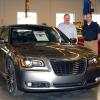 Penn College automotive instructors Chad H. Rudloff (left) and Christopher A. Trapani with a 2012 Chrysler 300, one of the first two vehicles donated by the automaker to the new Mopar CAP major.