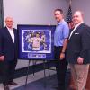 Little League International Board Chair Hugh E. Tanner (right) joins artist Fred Gilmour (left) and Mussina alongside a composite painting.