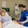 A Pennsylvania College of Technology nursing student interacts with SimMan, a patient simulator that can be electronically controlled to display real-life symptoms. The college’s nursing graduates again surpassed state and national pass rates on their licensure exams, including a 100% pass rate by graduates of the associate degree registered nurse preparation major.