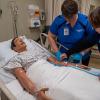 Pennsylvania College of Technology nursing student Johnette A. Michaels (left), of Danville, practices IV insertion alongside Ann E. Morrison, instructor of nursing. Penn College recently announced that it will no longer require the Test of Essential Academic Skills as part of the criteria for selective admission into its nursing majors. 