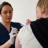 Penn College nursing student Abby C. Busch, of Troy, provides a flu shot to Susquehanna Health employee Tanja Speck during an employee flu shot clinic at Williamsport Hospital.