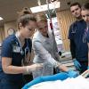 Pennsylvania College of Technology’s Tushanna M. Habalar, instructor of nursing, guides student Lindsay C. Dunkelberger (left), of Centre Hall, in placing an IV in SimMan, a wirelessly controlled patient simulator.