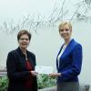 Teri MacBride (left), PPL’s regional affairs director, presents a $3,000 check to Elizabeth A. Biddle, Penn College’s director of corporate relations.