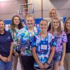 PPL Electric Utilities representatives Mary Baker (left), a forester for the company, and Tracie Witter, regional affairs director, gather with a team of campers who show off the robot they built during Penn College’s annual SMART Girls summer camp. PPL supported SMART Girls and the college’s dual-enrollment program through a $4,000 donation. Joining the group is Elizabeth A. Biddle (back row), director of corporate relations for the college.