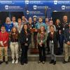 The 20-member Penn College contingent, properly identified with visitor badges, pauses for a group photo during its tour of the Pennsylvania Emergency Management Agency in Harrisburg. Joining students on their inspiring outing is William A. Schlosser (right), emergency management and homeland security instructor. 