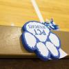 A foam Wildcat paw, a giveaway at a recent hoops doubleheader, lends silent support to the home team.