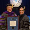 State Sen. Gene Yaw, chairman of the Pennsylvania College of Technology Board of Directors, is presented with the Centennial Leadership Award by Penn College President Davie Jane Gilmour at the college's Winter Commencement ceremonies.