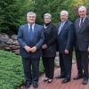 Penn State President Eric J. Barron (left) is joined on the verdant grounds of the Victorian House by (from right) Robert E. Dunham, chairman emeritus of the Penn College Board of Directors; state Sen. Gene Yaw, current board chairman; and Penn College President Davie Jane Gilmour.