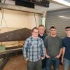 Keith H. English, instructor of automated manufacturing and machining, second from left, with three of the 25 Penn College students involved with manufacturing a press brake. The students, from left, are initial designer Jason B. Miller, manufacturing engineering technology, Mount Joy; Brandon M. Littlefield, automated manufacturing technology, Russell; and Michael A. Johnson, manufacturing engineering technology, Warren.