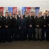 Before a shimmery curtain of red-white-and-blue fringe, the president (center) and Penn College staff celebrate with some of the night's biggest VIPs: the Bald Eagle Battalion's Wildcat cadre.