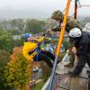 The president gamely prepares to step off the rooftop.