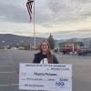 Regina M. Peluzzo, a civil engineering technology major from Philadelphia, holds an oversized scholarship check outside Pennsylvania College of Technology’s Student & Administrative Services Center. Peluzzo, who serves in the U.S. Air Force and is employed as a Veterans Affairs work-study student, was recently awarded $2,000 from the American Society of Civil Engineers’ Central Pennsylvania Section.