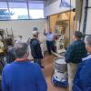 Gary E. McQuay, PIRC engineering manager, demonstrates a materials grinder in Penn College’s Rotational Molding Center of Excellence.