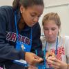 Young women enrolled in SMART Girls, among the wide-ranging roster of pre-college programs at Pennsylvania College of Technology, assemble a robot during last summer’s camp.