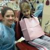 Brittany N. Hall, of York, with a young patient who just had sealants placed