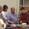 Penn College plastics students work in an extrusion lab under the direction of Gary E. McQuay, center, engineering manager for the Plastics Innovation Resource Center at the college. Sekisui SPI, part of Sekisui Chemical Co., is establishing a scholarship for first-year plastics students at Penn College.