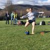 About to blast an instrumented ball is Kayla M. Spotts, of Shamokin, among the Wildcat soccer players cooperating in an exercise with civil engineering and surveying students at Penn College.