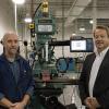 Rudy Gebhard (right), senior sales representative for Southwestern Industries Inc., and Richard K. Hendricks Jr., instructor and department head of automated manufacturing and machining at Penn College, with a TRAK KMX milling machine donated by Southwestern Industries