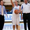 Kierstin Steer acknowledges her historic accomplishment alongside Scott E. Kennell, director of Wildcat athletics (left), and women's basketball coach Matt Wilt.