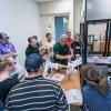 Mark Strachan (in green shirt), senior technology director for First Quality Packaging Solutions in West Palm Beach, Florida, and former chairman of the Society of Plastics Engineers Thermoforming Division, reviews results of a temperature change with participants at the Eighth Annual National Hands-On Thin-Gauge/Roll-Fed Thermoforming Workshop at Penn College’s Plastics Innovation & Resource Center.