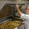 Penn College student Kori A. Treaster, of Lewistown, staffs a kitchen at Churchill Downs as she helps prepare food for guests at the 2016 running of the Kentucky Derby. Treaster and 27 other Penn College students will return for Derby Week in May.