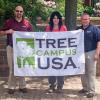 Holding a banner proclaiming Penn College's ongoing “Tree Campus USA” designation are (from left) Don J. Luke, director of facilities operations; Andrea L. Mull, horticulturist/grounds and motorpool supervisor; and Carl J. Bower Jr., assistant professor of horticulture. Not pictured is Andrew Bartholomay, assistant professor of forestry, another collaborator in the college's stewardship success.