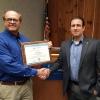 Timothy S. Turnbach (left),  an instructor of welding at Penn College, receives the Howard E. Adkins Memorial Instructor Section Award from Michael S. Sebergandio, American Welding Society District 3 director, during a recent ceremony at the college.