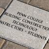 The keystone of the Penn College pathway, centered over the honorees' names below