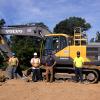 Gathered in and around a Volvo EC220 excavator on loan for use at Pennsylvania College of Technology's training site are (standing, from left) student Kyle R. Spoor, of Thompson; Ryan W. Peck, diesel equipment technology instructor; Ryan Flood, vice president, Highway Equipment & Supply Co.; and student Julian A. Kendter, of Doylestown. Seated inside is student Collin L. Yetter, of Liverpool. All three students are enrolled in heavy construction equipment technology: operator emphasis. 