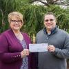 Debra M. Miller, college relations advisor at Penn College, accepts a Herman O. West Foundation grant from Dave Lanzer, director of operations at West Pharmaceutical Services Inc. The grant will be used to establish an endowed scholarship at the college. 