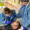 With aim of early detection, students screen for oral cancer